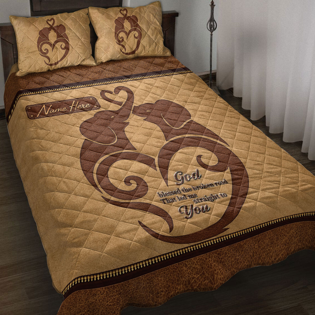 Elephant couple quilt blanket displayed on a bed with warm brown romantic artwork