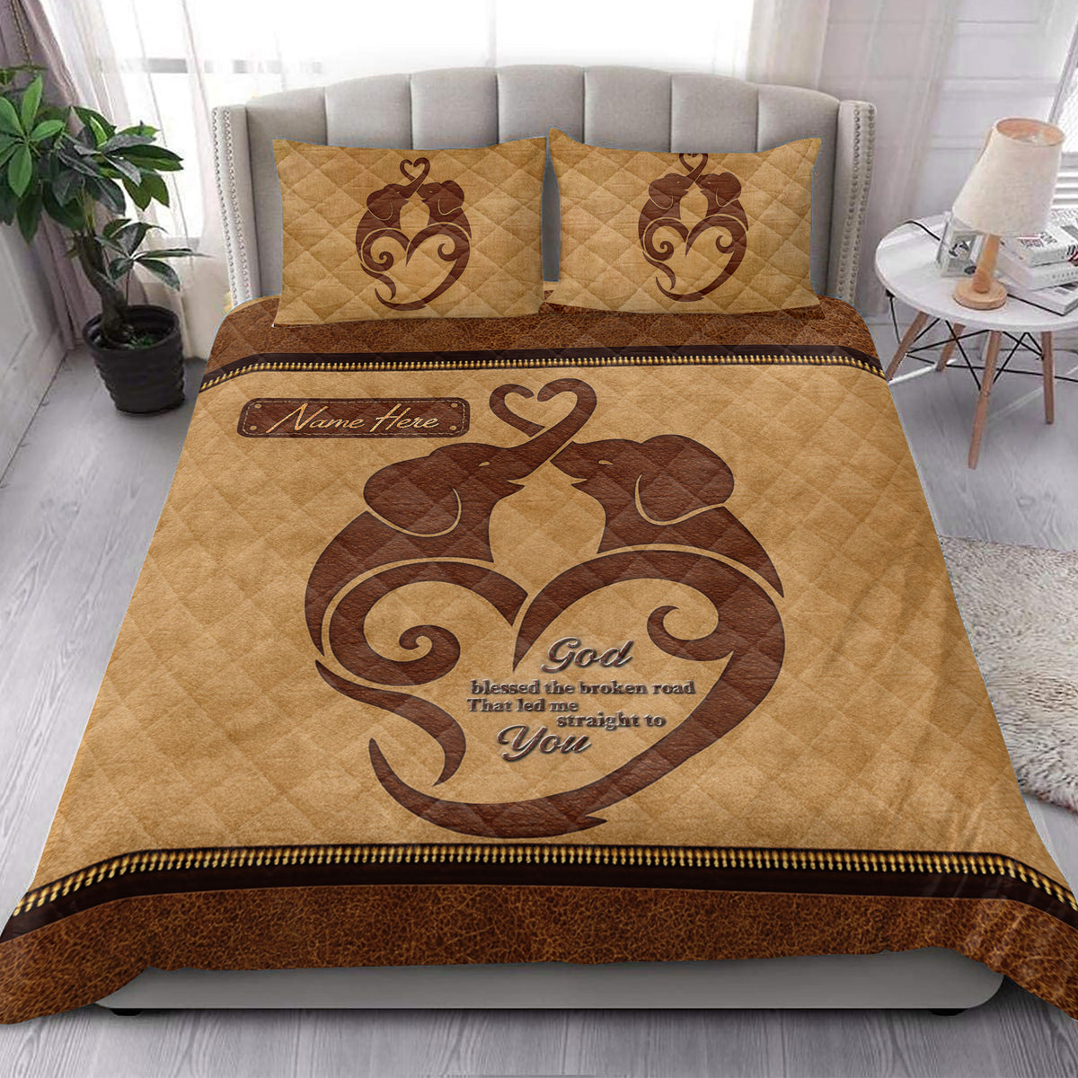 Romantic elephant couple quilt blanket styled in a bright modern bedroom