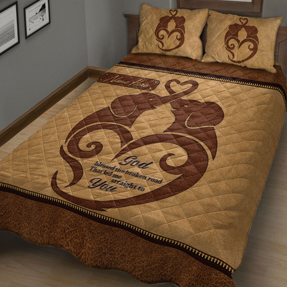 Close bedroom view of a brown elephant couple quilt with heart-themed artwork