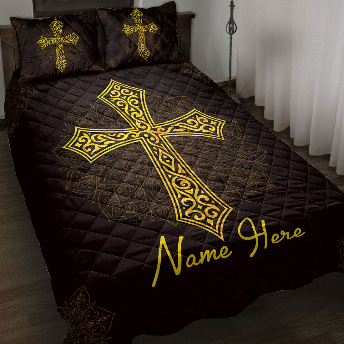 Black Christian cross quilt blanket with ornate gold artwork styled on a bedroom bed
