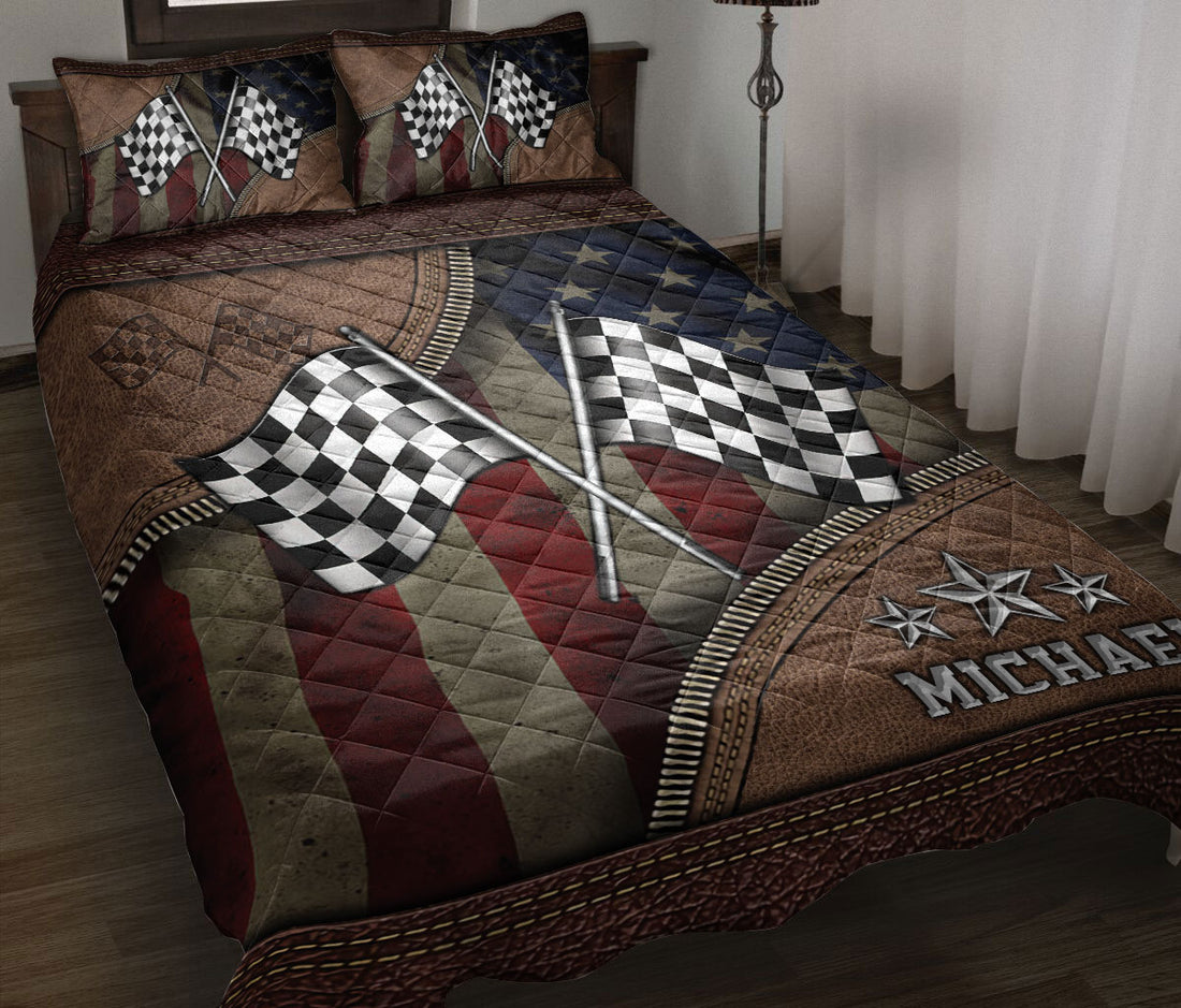 Racing quilt blanket displayed on a bed with crossed checkered flags, stars, and rugged motorsport artwork