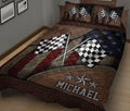 Close bedroom view of a racing quilt blanket featuring waving checkered flags and star accents