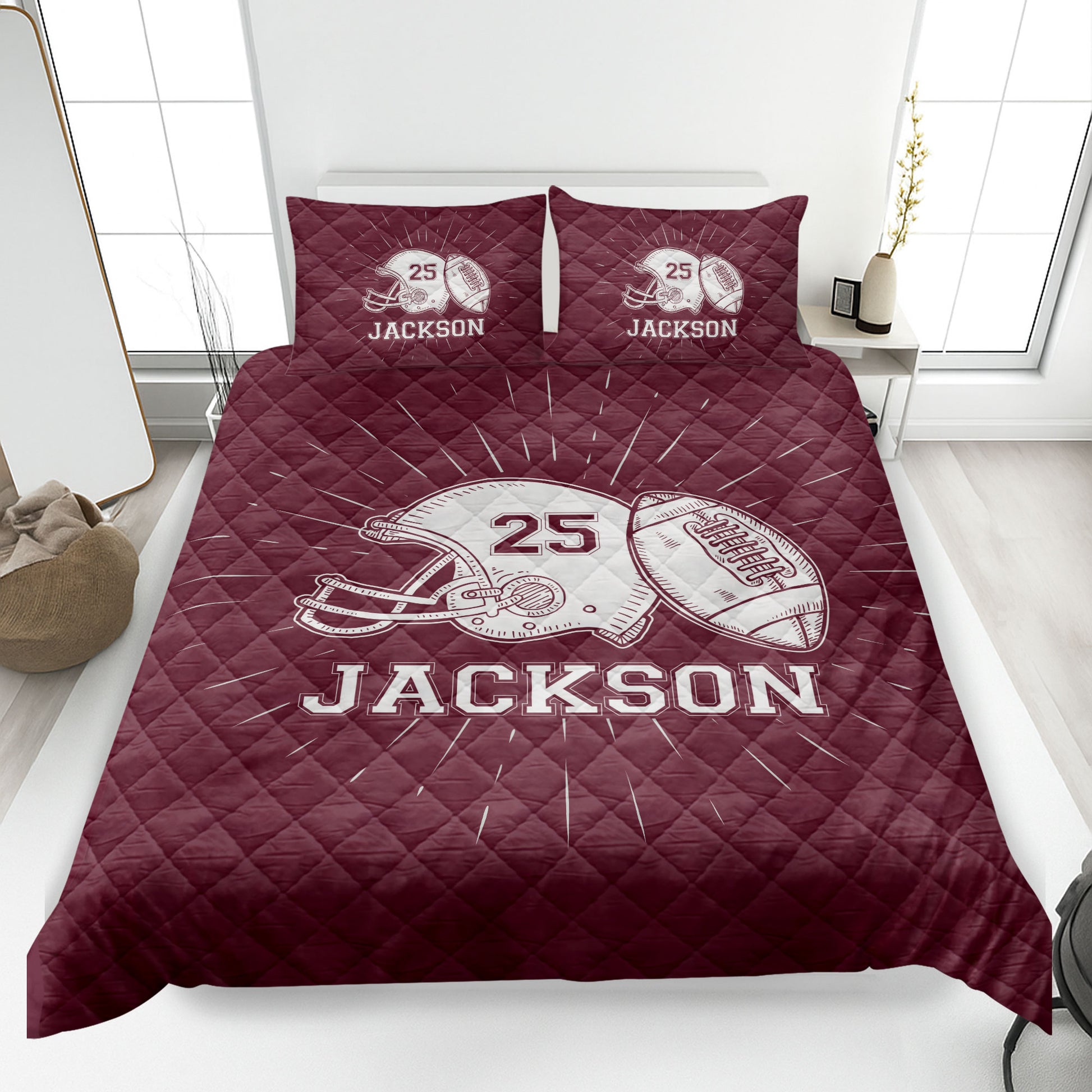 Maroon football quilt blanket featuring helmet and football artwork in a bedroom setting