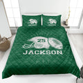 Green football quilt blanket displayed with bold helmet and football sports artwork