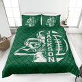 Green football quilt blanket styled in a bedroom with bold player and football graphics