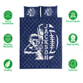 Navy football quilt bedding set shown with quilted texture and care feature icons