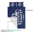 Football quilt blanket detail showing the printed front and white quilted backing