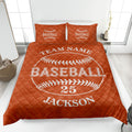 Orange baseball quilt blanket shown on a bed with bold baseball graphics and team-themed artwork
