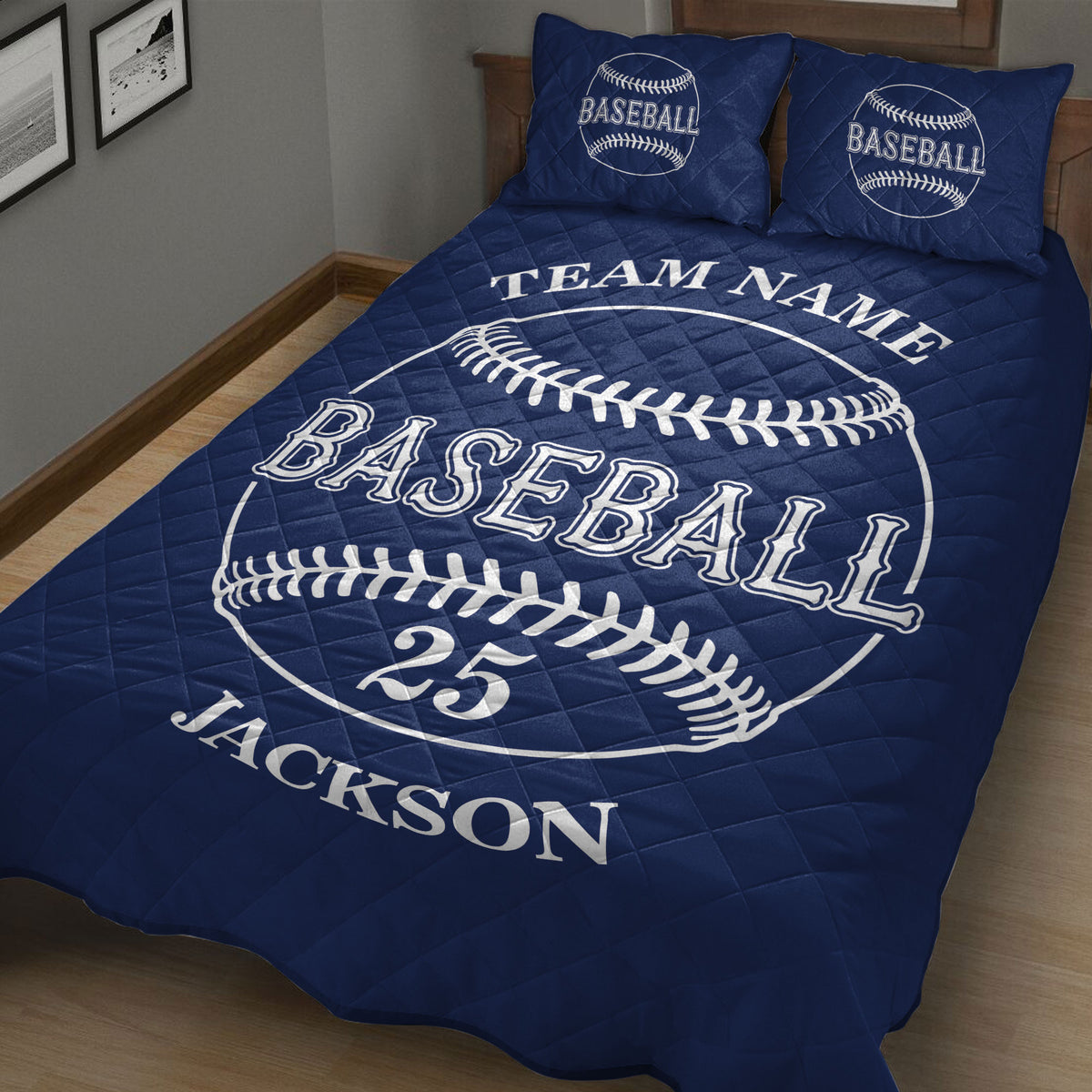 Navy baseball quilt blanket styled in a bedroom with oversized baseball graphics and bold lettering