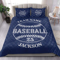 Navy baseball quilt blanket presented in a bright bedroom with baseball graphics and decorative pillows