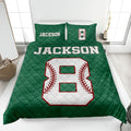Green baseball quilt blanket styled in a bedroom with bold varsity-inspired sports artwork