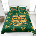 Green softball quilt blanket on a bedroom bed featuring golden stitched softball hearts and bold sports artwork