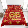 Red softball quilt blanket on a bedroom bed with golden stitched softball hearts and bold athletic design