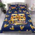 Navy softball quilt blanket styled in a bright bedroom with stitched softball hearts and bold golden sports artwork