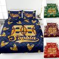 Softball quilt blanket displayed on a bed with stitched softball hearts, bold sports artwork, and color variations