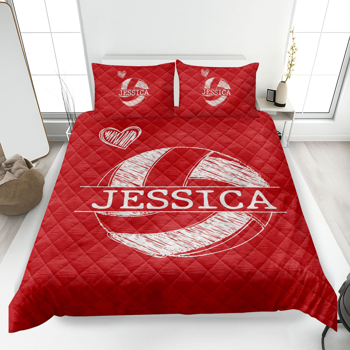 Red volleyball quilt blanket shown on a bed with heart details and prominent sports artwork