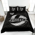 Black volleyball quilt bedding displayed in a modern bedroom with white graphic artwork