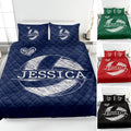 Navy volleyball quilt bedding displayed on a bed with heart accents and multiple color options