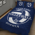 Close bedroom view of a navy volleyball quilt blanket with large ball artwork and athletic decor style