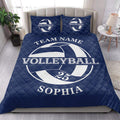 Navy volleyball quilt bedding set styled in a bright bedroom with matching volleyball graphic pillows