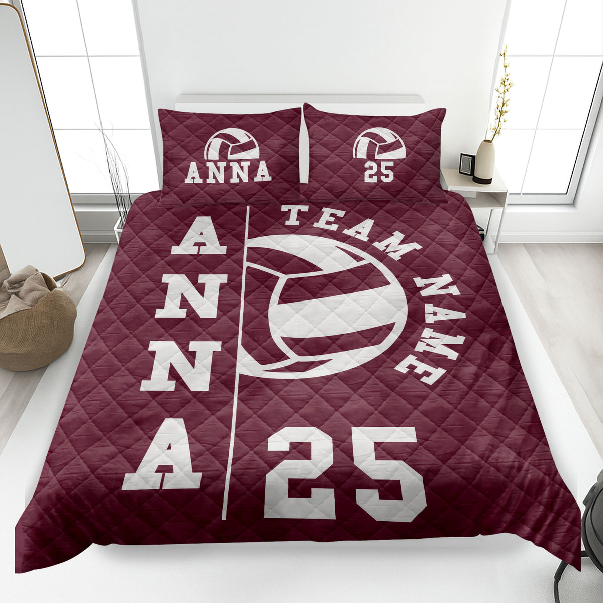 Maroon volleyball quilt blanket displayed on a bed with bold white sports artwork
