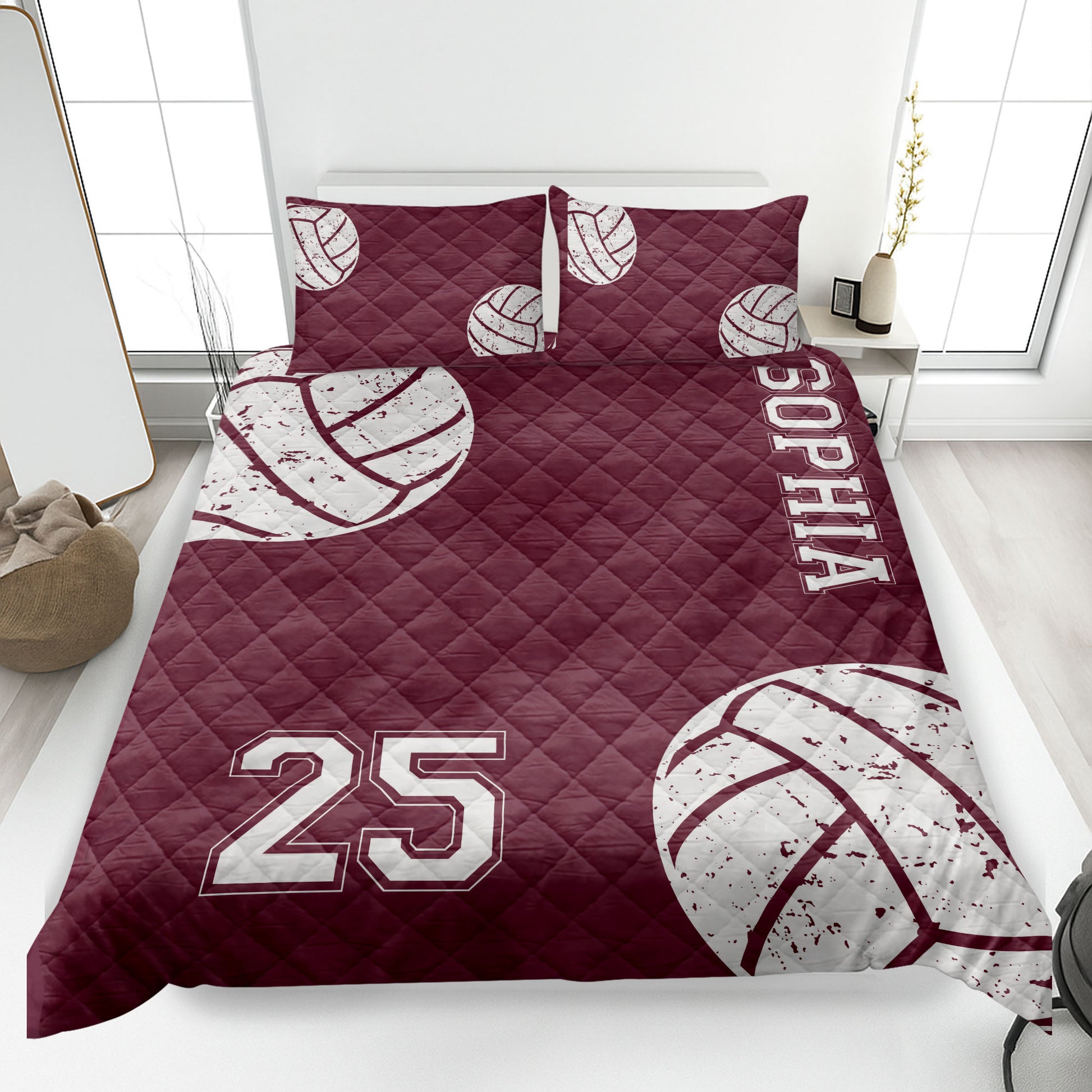 Maroon volleyball quilt blanket featuring white volleyball artwork and athletic bedroom styling