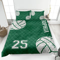 Green volleyball quilt blanket with distressed white volleyball graphics and bold athletic design