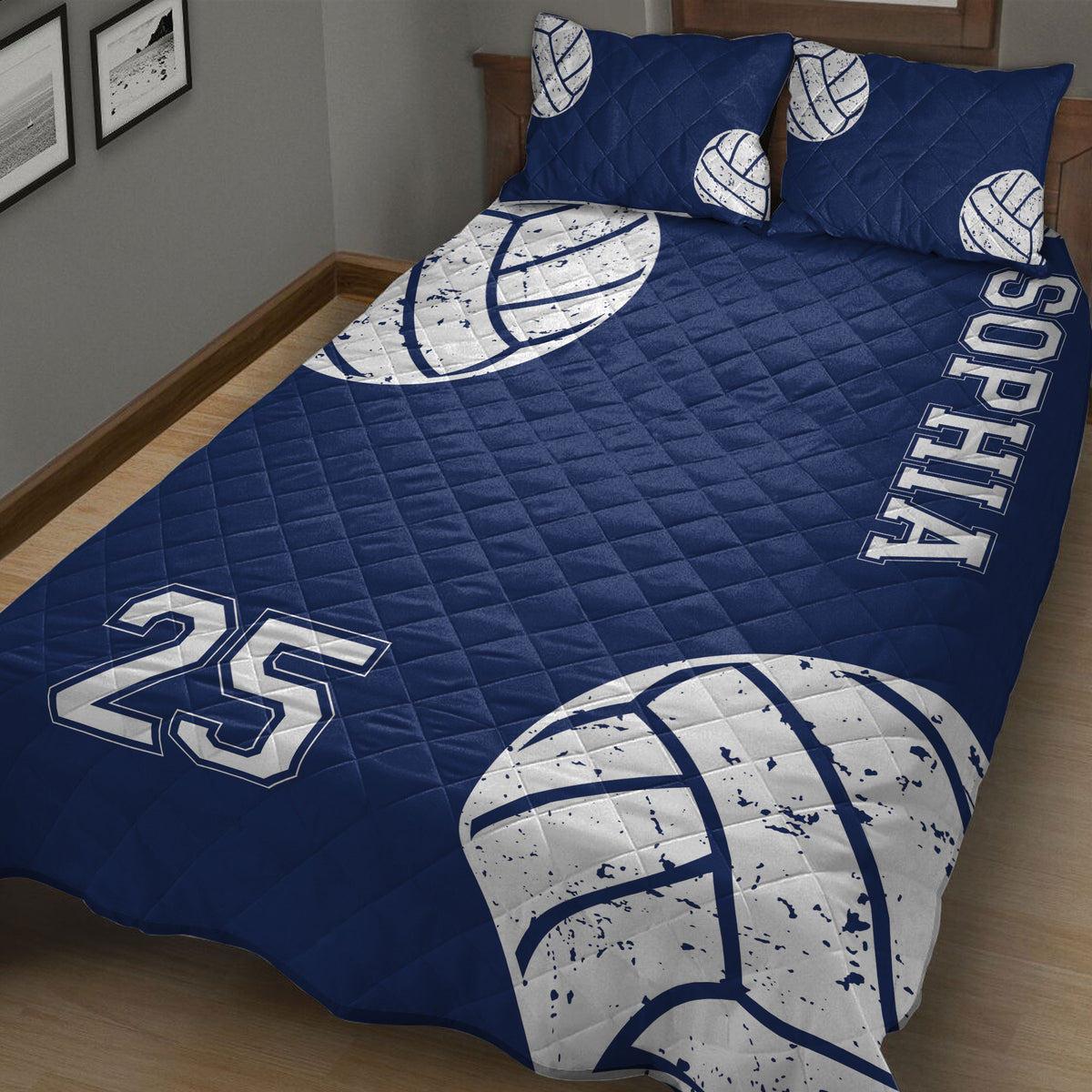 Navy volleyball quilt blanket styled in a bedroom with oversized volleyball graphics