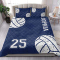 Navy volleyball quilt bedding set displayed in a bright bedroom with matching volleyball artwork