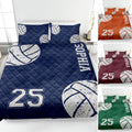 Navy volleyball quilt blanket on a bed with white volleyball graphics and bold sports-style lettering