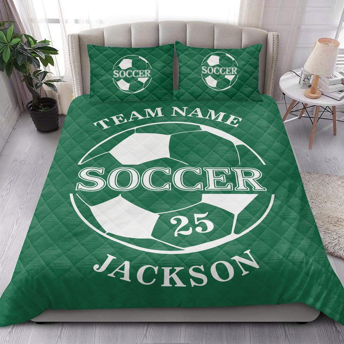 Green soccer quilt blanket shown in a bright bedroom with soccer ball graphics and coordinated bedding