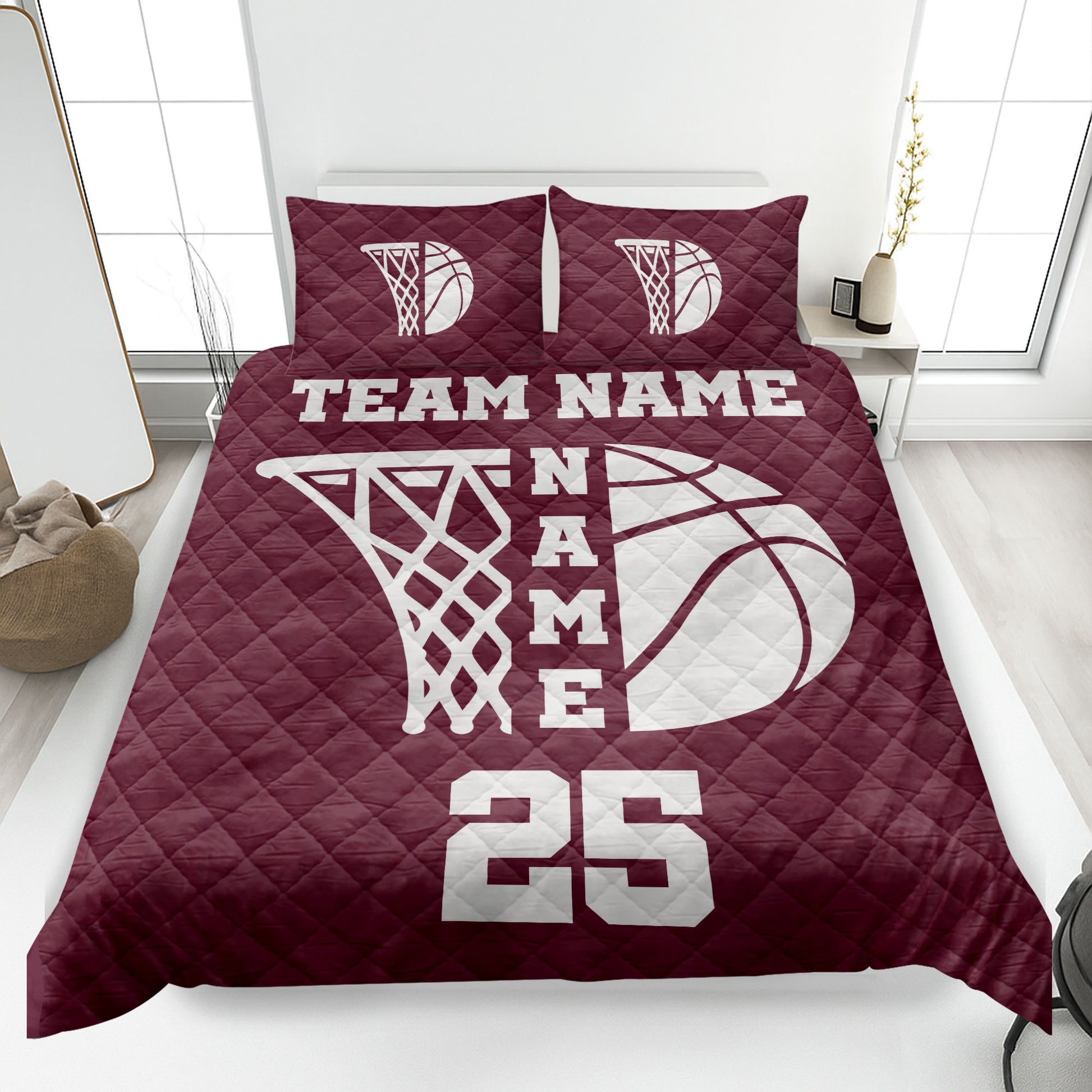 Maroon basketball quilt blanket featuring a large white hoop and basketball design on a bedroom bed