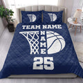 Navy basketball quilt bedding set styled in a bright bedroom with coordinated basketball artwork