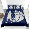 Navy basketball quilt blanket featuring a large basketball, player silhouette, and bold monochrome sports artwork