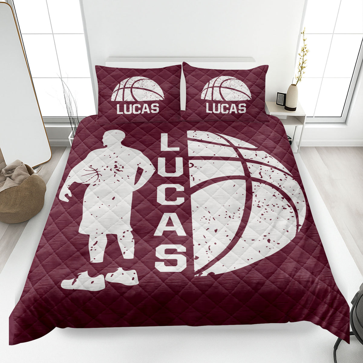 Maroon basketball quilt blanket with an active player silhouette, oversized basketball graphic, and quilted texture