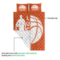 Orange basketball quilt shown with a folded corner revealing the white quilted backing and printed front design