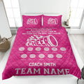 Bright pink cheerleading quilt blanket with white megaphone and pom-pom design in a bedroom