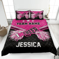 Pink and black cheerleading quilt blanket with pom-pom artwork and bold team-inspired bedroom design