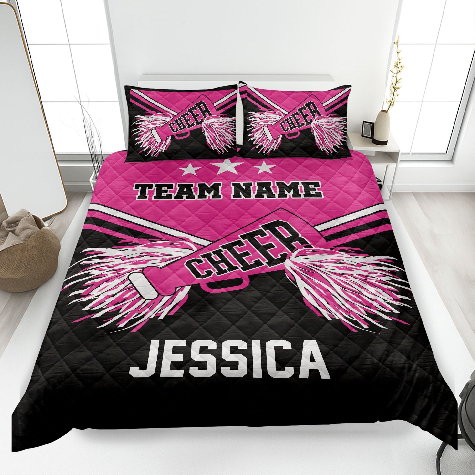 Pink and black cheerleading quilt blanket with pom-pom artwork and bold team-inspired bedroom design