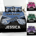 Cheerleading quilt blanket displayed on a bed with pom-poms, stars, team graphics, and multiple color options