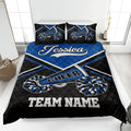 Blue and black cheerleading quilt blanket with pom-poms and bold team-style bedroom design
