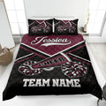 Maroon and black cheerleading quilt blanket with pom-pom artwork in a bedroom setting
