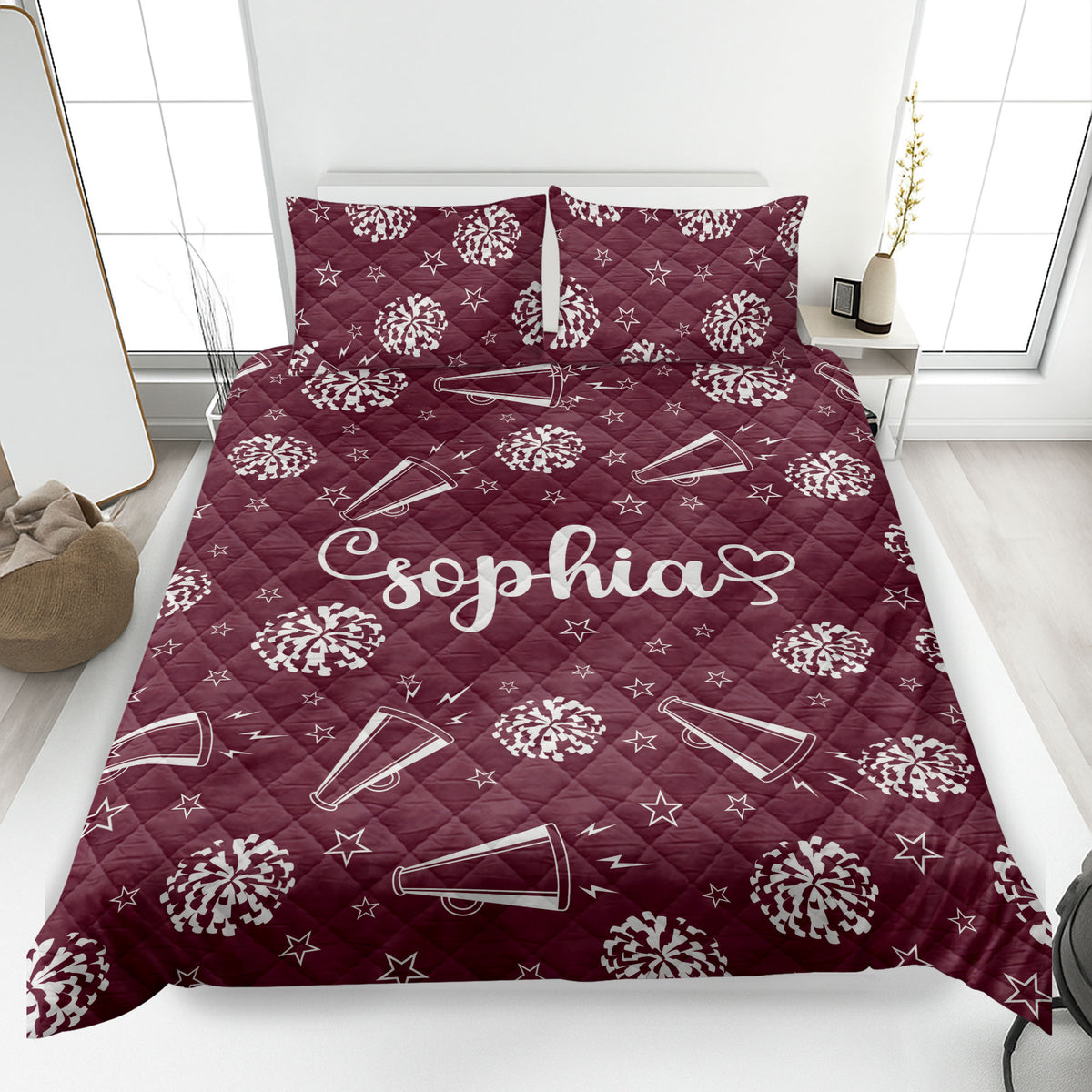 Maroon cheerleading quilt blanket featuring white pom-poms, megaphones, stars, and lightning details