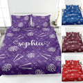 Purple cheerleading quilt blanket on a bed with pom-poms, megaphones, stars, and lightning artwork