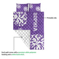 Purple cheerleading quilt showing the printed front and white quilted reverse side