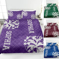 Purple cheerleading quilt blanket on a bed with pom-pom artwork and alternate color previews