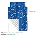 Blue hockey quilt blanket detail showing the printed front and soft white quilted backing
