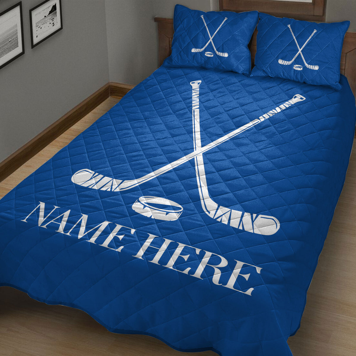 Blue hockey bedding displayed in a bedroom with crossed sticks, puck artwork, and bold sports styling