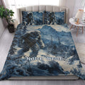 Bigfoot quilt blanket styled in a bright bedroom with matching mountain artwork