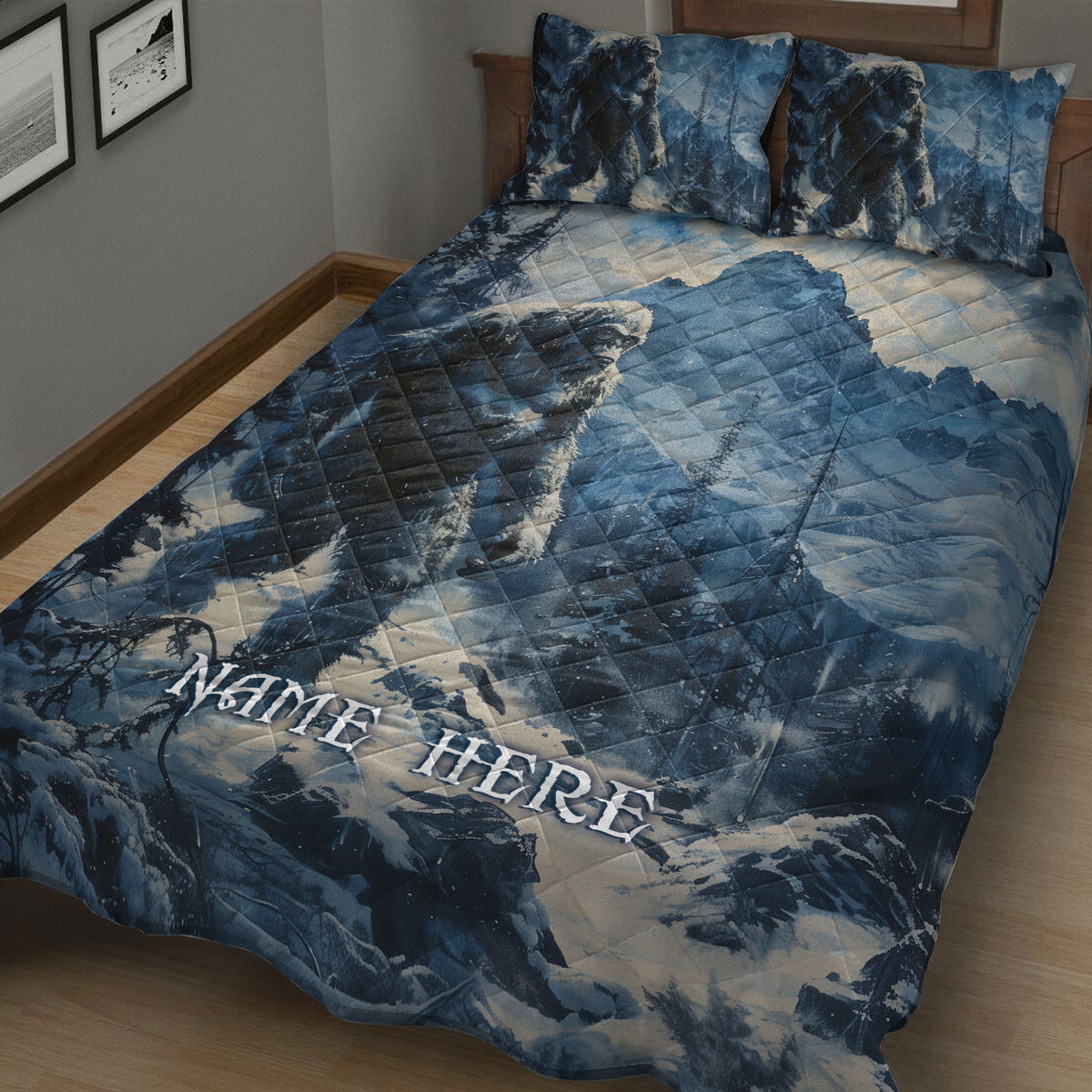 Close bedroom view of blue Bigfoot quilt blanket with forest and mountain scenery